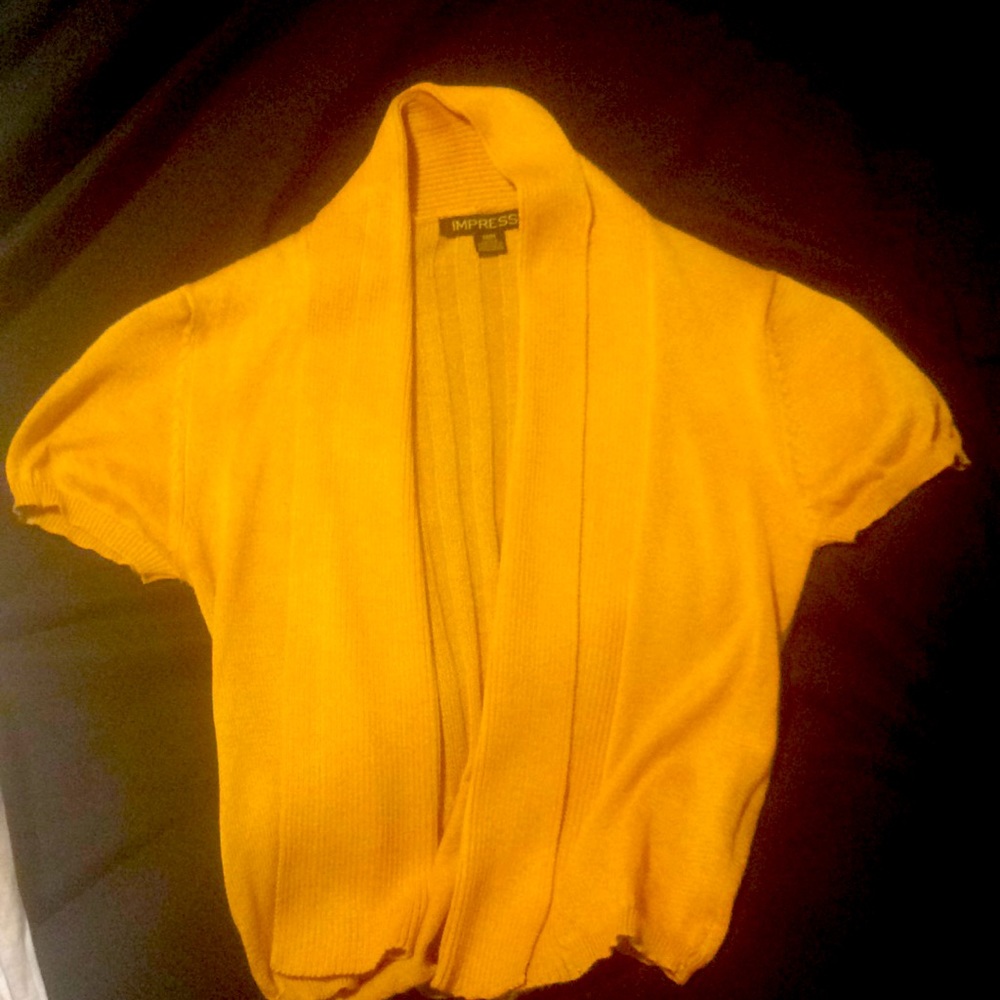 Medium golden yellow cardigan.